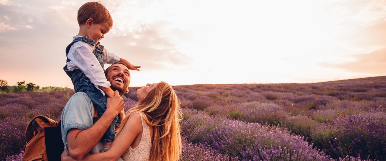 Photo of happy little family enjoying together at the lavender field